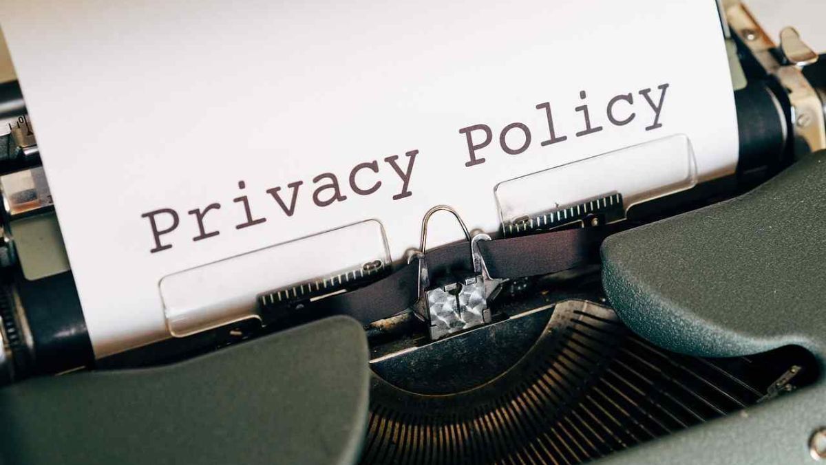 A Privacy Policy document placed into a mechanical typewriter