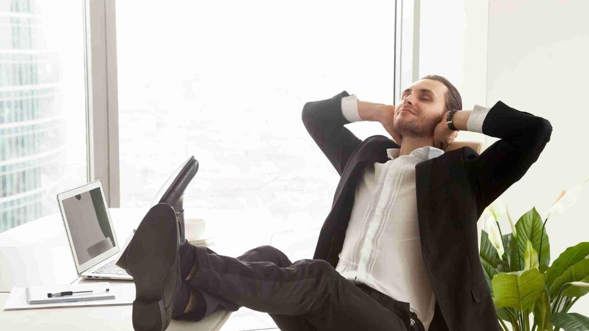 A businessman taking a break and enjoying a moment of relaxation in an office