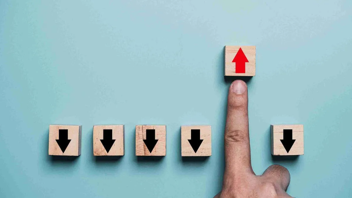A finger-pointing on a block with a red arrow going upward with five other blocks with black arrows pointing downward