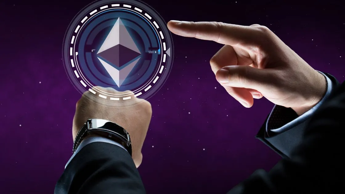 A hand reaching towards a holographic projection of the Ethereum logo against a cosmic starry background.