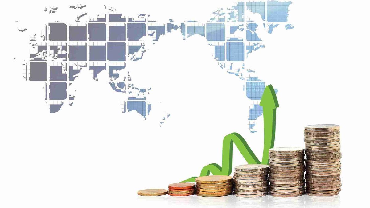 A map illustration as a backdrop accompanied by a stack of coins and a green arrow pointing upwards