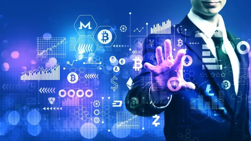A person in a business suit interacting with a holographic interface of various cryptocurrency symbols and financial graphs