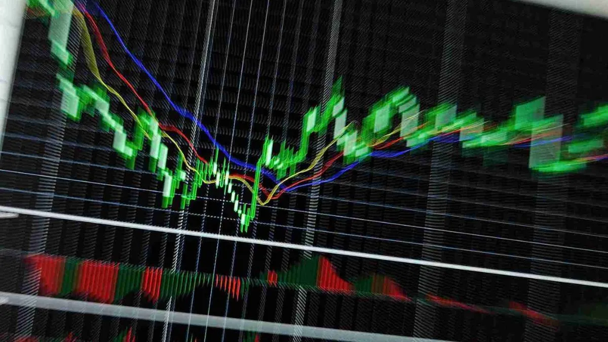 A trading chart displaying vibrant green trading patterns with three colored lines
