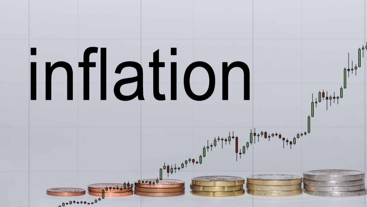 A word inflation candlestick patterns and coins stack in a row increasing