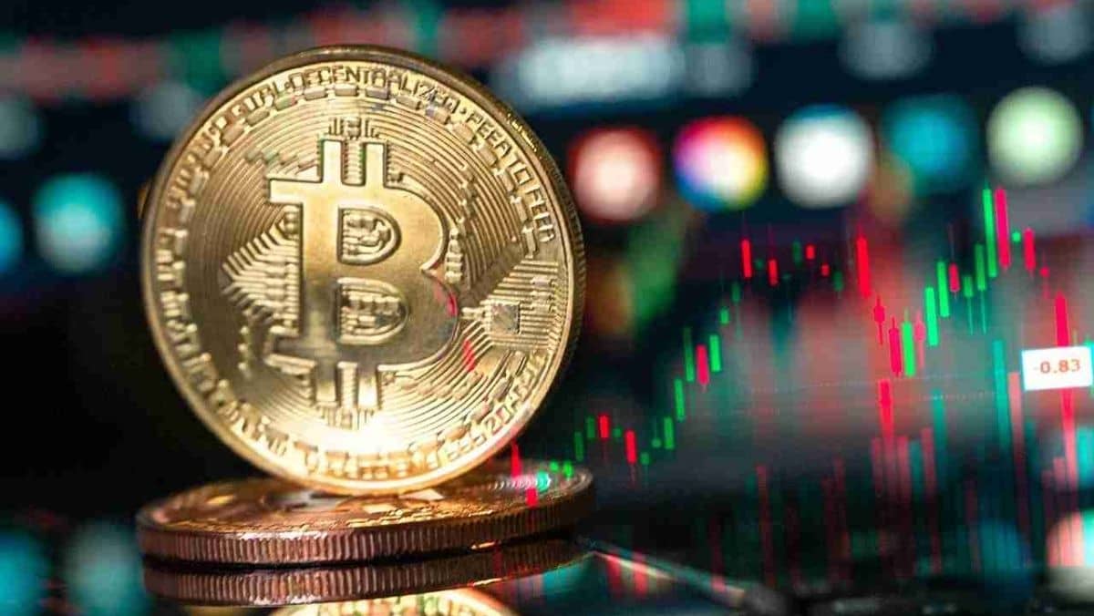 A zoomed-in view of Bitcoin with a trading chart pattern in the background