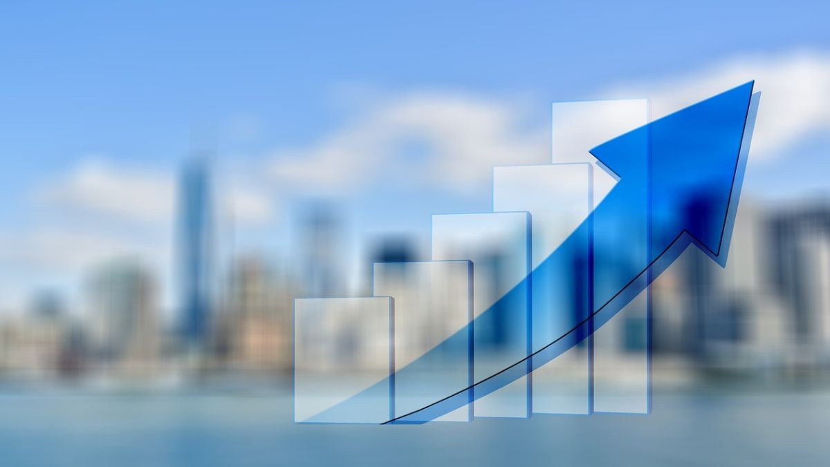 An ascending arrow accompanying a bar graph set against the backdrop of blurred buildings