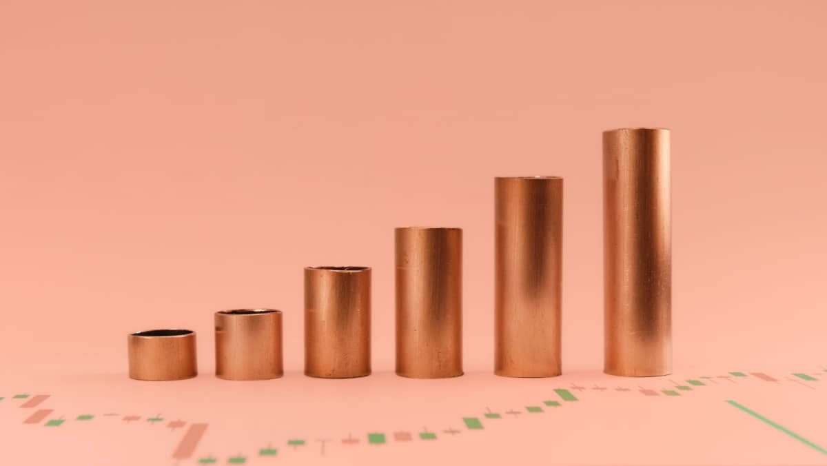 Copper tubes forming a growth curve, representing the growth of copper and other commodity prices