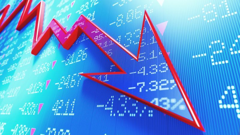 Digital stock market chart showing a red arrow trending downward, indicating a market decline