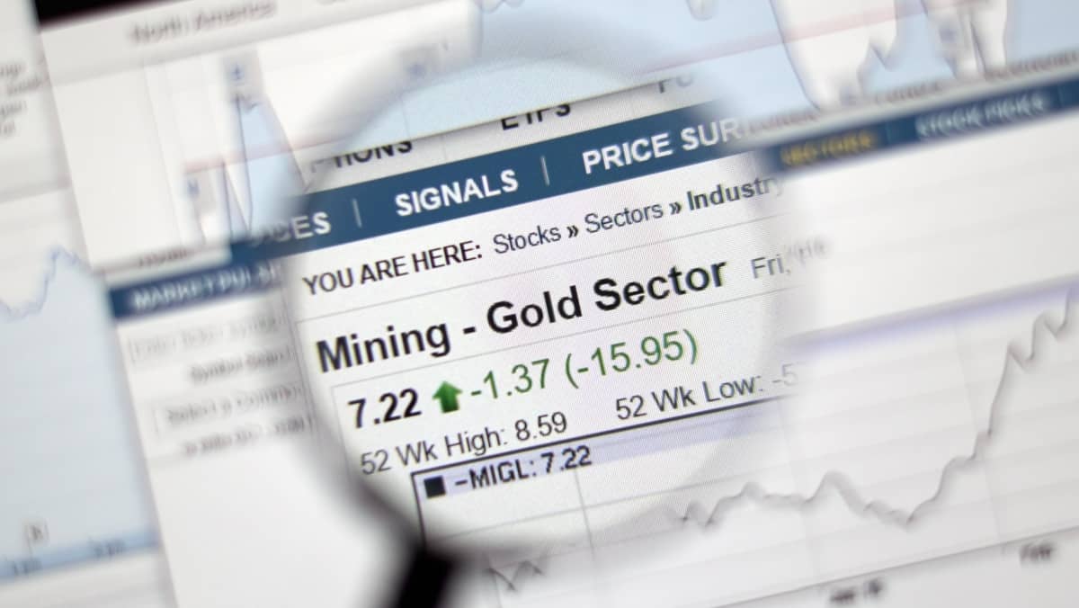 MONTREAL, CANADA - FEBRUARY, 2016 - Mining - Gold sector of stock market under magnifying glass.