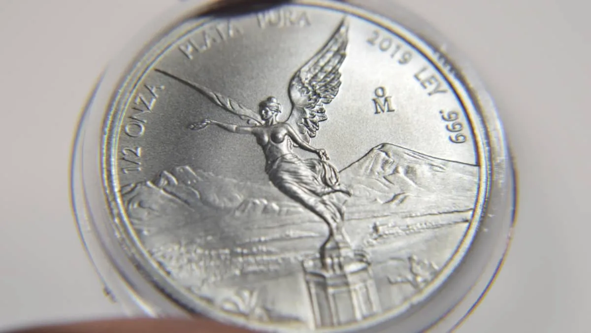 Mexican Libertad Silver Coin. Growth pile of pure silver coins from mexico named  onza libertad