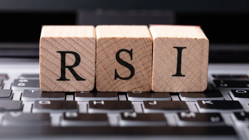 Wooden blocks on a keyboard spelling out RSI for Relative Strength Index