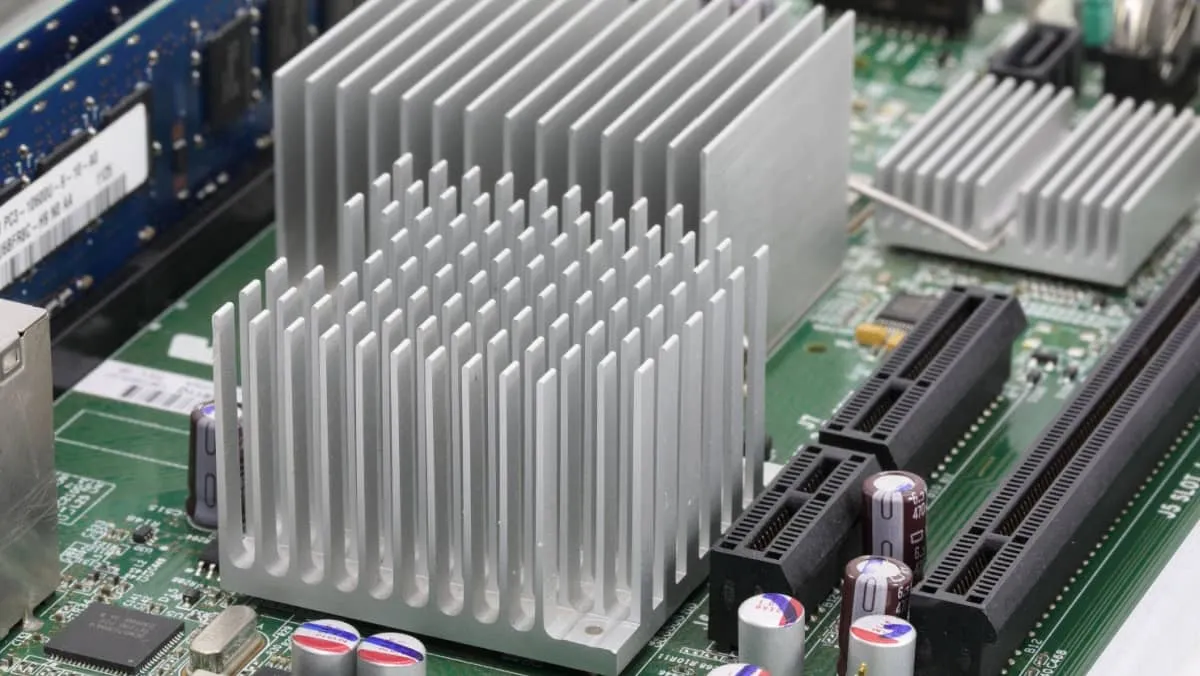 heat sink or computer processor cooler or radiator on computer motherboard