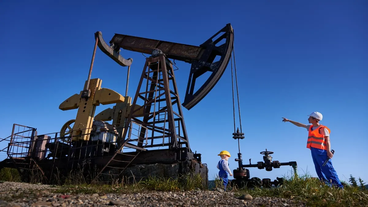 mechanic-showing-operation-of-petroleum-rig-to-sma-width-1200-format-JPEG.jpg