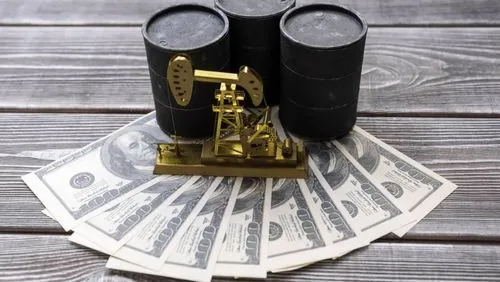 three barrels of oil, neftechka, and American dollars against the background of a wooden table