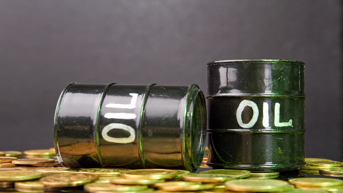 two-oil-barrels-on-the-pile-of-golden-coins-width-1200-format-JPEG.jpg
